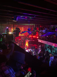 a crowd of people at a bar